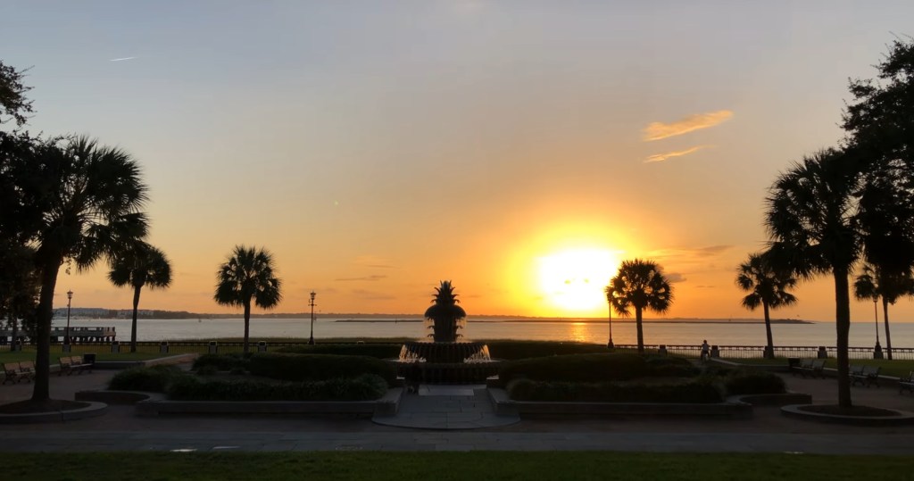 A pineapple fountain in front of the sunset, symbolizing the charming town of Summerville, known as Charleston's younger sister.